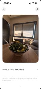 a bowl of vegetables is sitting on a table at Chambre avec WC privée pr 1p dans un appart partagé avec 1p in Sidi Maarouf