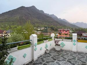 a balcony with a view of a mountain at FarahBakshResidency in Jāmb
