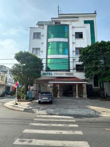 a car parked in front of a hotel at SEAMOON Hotel in Rạch Giá
