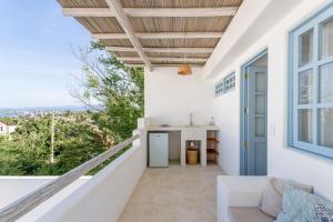 a balcony with a view of the city at Punta Mayia in Brisas de Zicatela