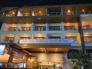 a building with a sign that reads ball sum tropical hotel and spa at Bali Sun Tropical Hotel & Spa - formerly The Sun Hotel & Spa Legian in Legian