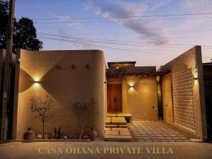 a house with a facade with a door and stairs at CASA Ohana Private Villa in Thai Muang