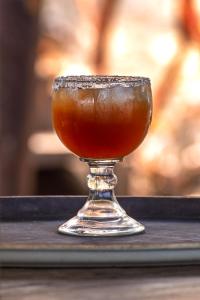 a drink in a glass on a table at Villas Isla Montosa in Coyuca de Benítez