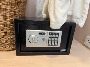 a microwave oven sitting on top of a table at Best House Luang Prabang in Luang Prabang