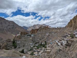 a village on the side of a mountain at Mochilero Eyrie in Kaza +26 photos
