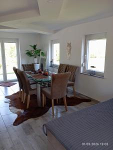 a dining room with a table and chairs at WallerKarpfenBosnien in Šiljkovača