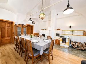a large dining room with a table and chairs at Rezidenca Korman in Fala