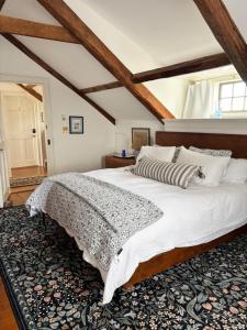 a bedroom with a large bed in a attic at Windsor House Inn in Saint Andrews
