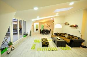 a living room with a couch and a table at Apartment Sovica in Belgrade