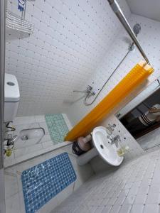 a bathroom with a sink and a toilet at Dada guest house in Bukhara +23 photos