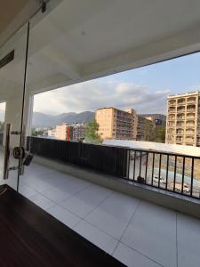 a balcony with a view of a city at Heaven Heights in Rājpur