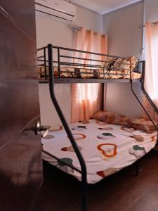 a bunk bed in a room with a bunk bedutenewayewayangering at A Peaceful House in Mexico