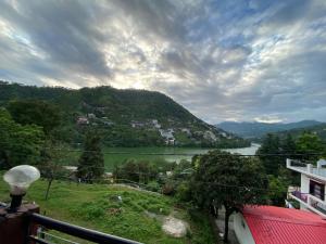 a view of a river from a balcony at The Mount lakes in Bhīm Tāl