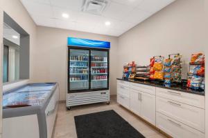 a store room with a refrigerator and some food at The J Hotel Dunedin Clearwater, an Ascend Collection Hotel in Dunedin
