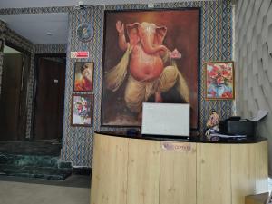 a room with a painting of a horse on the wall at Star Spandan in New Town
