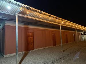 a building with lights on top of it at night at Cabinas El Mirador in Canoas