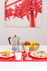 a table topped with plates of food and fruit at Apartamento luminoso y espacioso en Urdaibai in Elanchove +21 photos