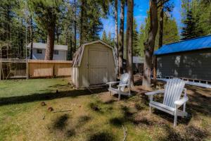 two chairs sitting in a yard next to a building at Royal Retreat Quiet & Cozy in South Lake Tahoe