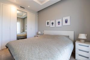 a bedroom with a large bed and a mirror at Nicolas in Casas Devesa +20 photos