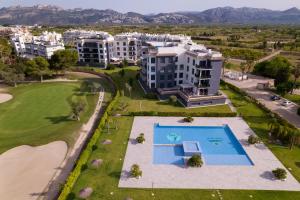 an aerial view of an apartment complex with a swimming pool at Nicolas in Casas Devesa