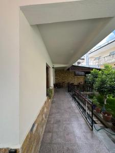 an empty hallway of a building with a balcony at Bujtina Valgent in Berat +69 photos