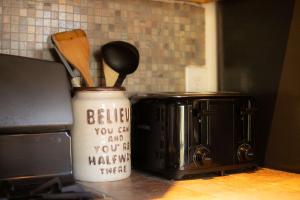 a kitchen counter with a coffee pot and a toaster at Tramway Haus Mountain Views in Stateline +14 photos