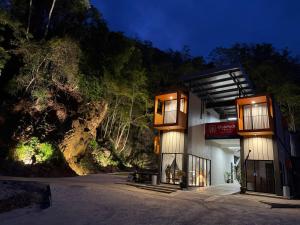 a building with two balconies on the side of a road at ClubRock Perlis Signature Hotel in Kaki Bukit