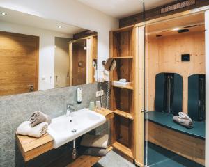 a bathroom with a sink and a shower at Appartements Alexander in Fiss +70 photos