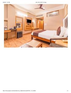 a hotel room with two beds and a kitchen at Hotel New Mamta in Srinagar