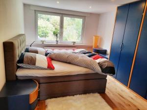 a bedroom with a large bed with a window at Modern apartment Selm Cappenberg in Selm
