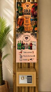 a sign for a drink pay in the box at SEVEN Guesthouse in Thong Sala