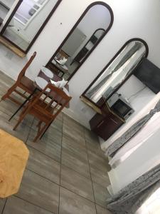 an overhead view of a living room with chairs and a mirror at Zanem Guest House in Potchefstroom