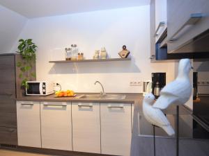 a kitchen with a statue of a bird on the counter at Apartment near ski area in Wehrstapel in Sauerland in Meschede