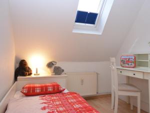a small bedroom with a bed and a window at Apartment near ski area in Wehrstapel in Sauerland in Meschede +85 photos