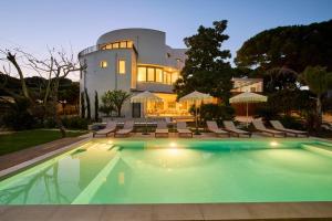 a large house with a swimming pool in front of it at Casa Redonda by Villas Aura - Retreat 2 in Aroeira
