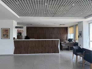a lobby with a reception desk in a building at Dorana Hotel Lefkoşa in Lefkosa Turk
