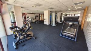 a gym with two exercise bikes and a treadmill at Jazmin ID300 in Villanueva de Río Segura