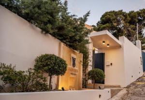 a building with a sign on the side of it at Ventus Villa - A Luxury Sea View Retreat in Akrotiri in Akrotiri