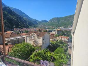a view of a city with mountains in the background at Žana in Kotor
