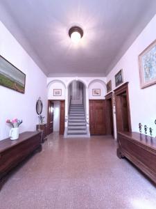 a large room with a staircase in a building at CupraScìScì in Cupra Marittima