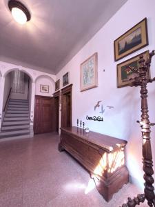 a living room with a wooden chess board on the wall at CupraScìScì in Cupra Marittima