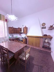 a kitchen with a table and chairs in a room at CupraScìScì in Cupra Marittima +28 photos