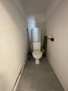 a bathroom with a toilet in a small room at studio idealement situé in Marseille