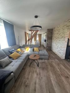 a living room with a couch and a table at Aluxhaus in Heidenau