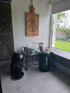 a room with a table with cups and a window at The Éire Escape Countryside Studio near Newgrange & Dublin in Slane +12 photos