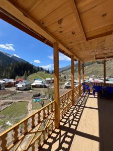 a view from the deck of a mountain house at Peak Paradise Resort in Taobat +16 photos