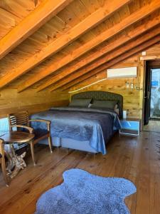 a bedroom with a bed and a wooden ceiling at Dere Evi in Rize