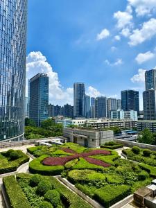 a view of a garden in a city at XiangNanLi Atelier Suites-Chengdu Chunxi Road & Taikoo Li in Chengdu