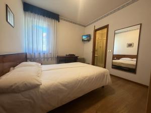 Llit o llits en una habitació de Single Rooms