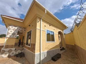 a house under construction with a window at Golden View Guest House in Lilongwe